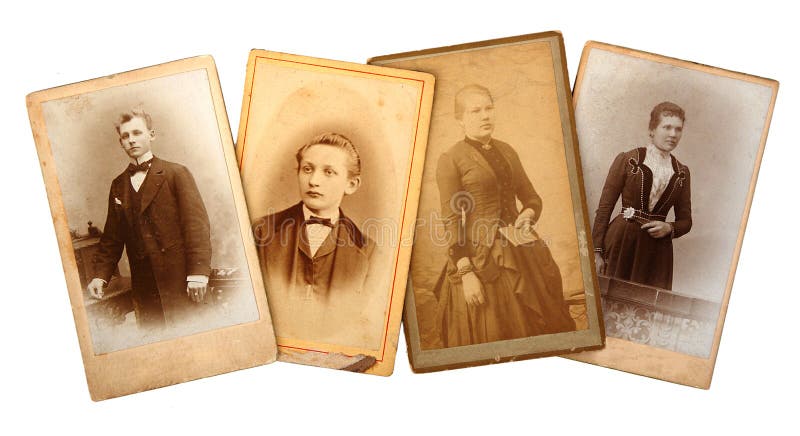 Vintage family photos and genealogy documents spread on a research desk